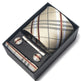Tie, cufflinks, and tie clip set in a black box with plaid pattern.