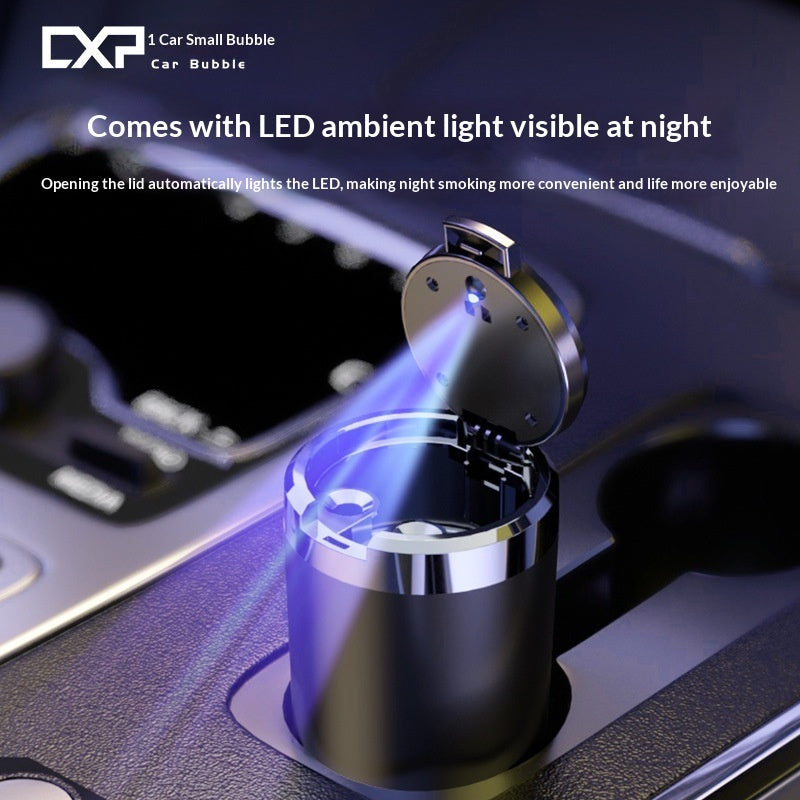 A car cigarette lighter shown in a cup holder with its lid open, emitting blue LED light. The image includes promotional text for 'CX3 Car Small Bubble Car Bubble' and highlights the automatic LED light feature.