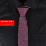 Black shirt with a purple tie and a red label with item number H7706-1.