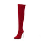 Red knee-high boot with a high heel on a white background