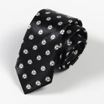Black tie with geometric pattern on a light gray background
