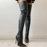 Black leather knee-high boots on a light background