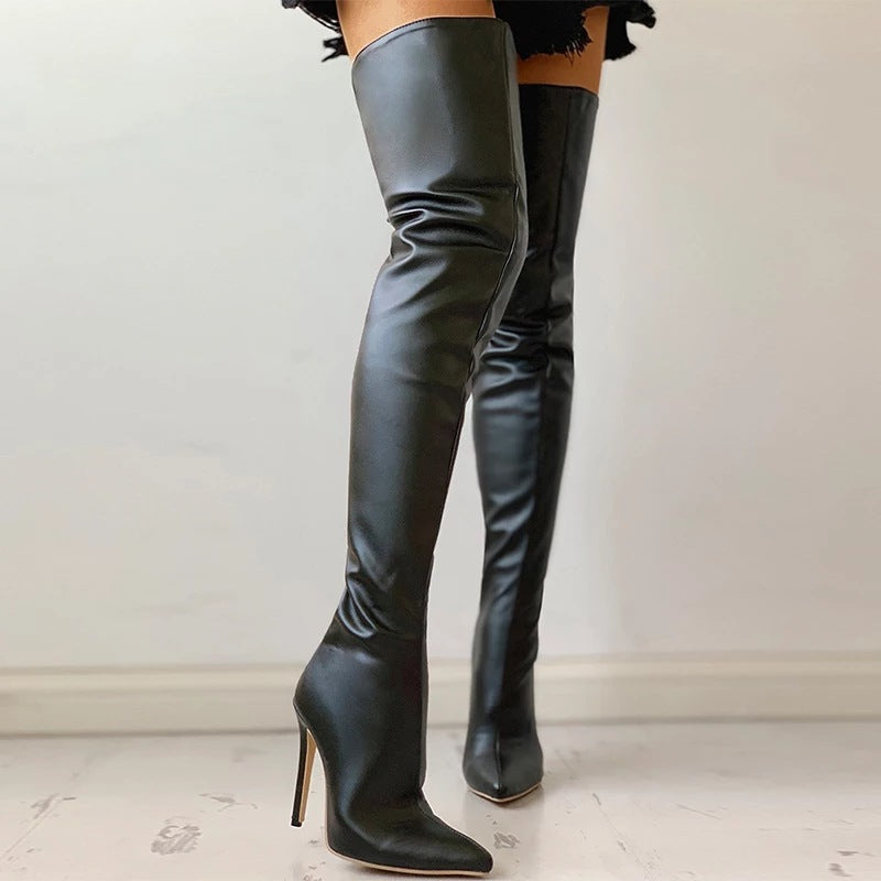Black leather knee-high boots on a light background