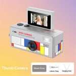 Silver gray mini camera with colorful design on a gradient background