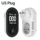 Air quality monitor with digital display and wall plug adapter on a white background