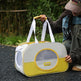 Person holding a yellow and white pet carrier outdoors. Foldable Breathable Cat Carrier Tote Bag – Oxford Cloth, Large Capacity, 8 Colours
