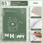 Green notebook with a cartoon dog illustration and text, featuring a frosted PP cover and removable hinges.