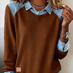 Brown sweatshirt with denim collar and cuffs worn by a person.