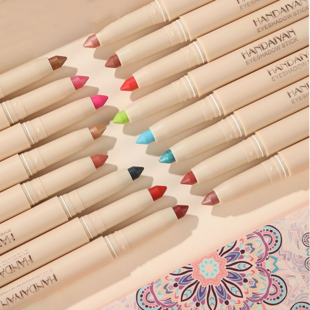 Set of Handanyan eyeshadow pencils with colorful caps on a decorative mat.