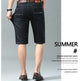 A man shown from the back wearing dark denim knee-length shorts, a white shirt, and brown shoes, with text on the right reading 'SUMMER #' and 'Summer casual men's pants' on a light gray background.