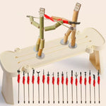 Toy setup with bamboo figures and fishing rods on a beige background