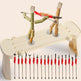 Toy setup with bamboo figures and fishing rods on a beige background