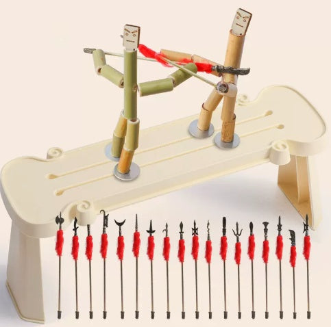 Toy setup with bamboo figures and fishing rods on a beige background