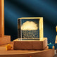 Glass block with water droplets on a wooden base against a dark blue background
