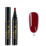 Nail art pen with black casing and gold text, next to a swatch of red nail polish on a white background.