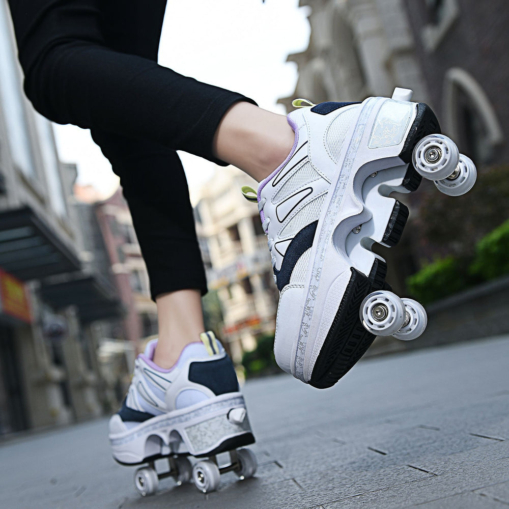 Person wearing white roller skates with black soles on a city street.