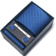 Blue tie set with tie clip, cufflinks, and pocket square in a black box on a white background