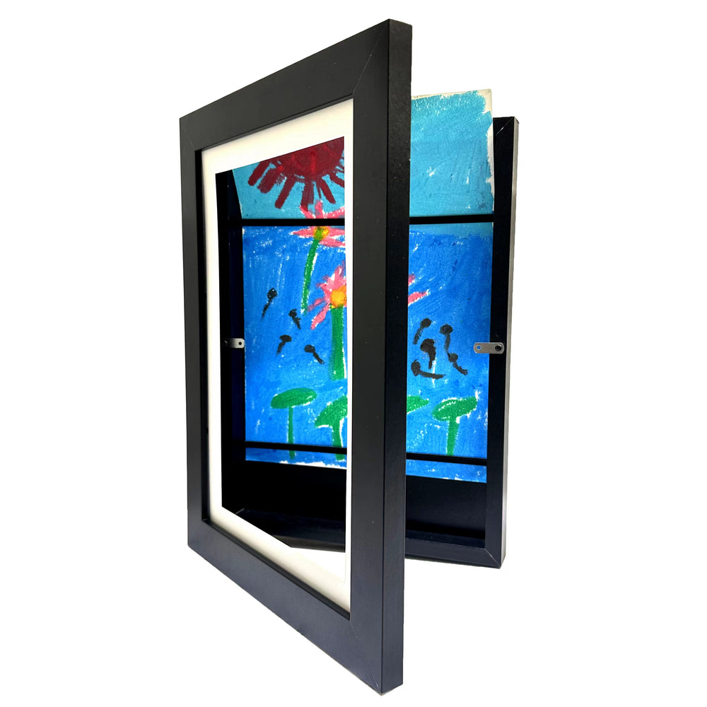Children's artwork displayed in a black frame on a white background
