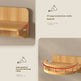 Product feature diagram showing a light wood wall-mounted shelf with annotations: a 90-degree corner support, a safety guardrail, and text explaining stability and fall prevention.