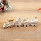 Wooden toy train set on a wooden surface with decorative elements in the background.