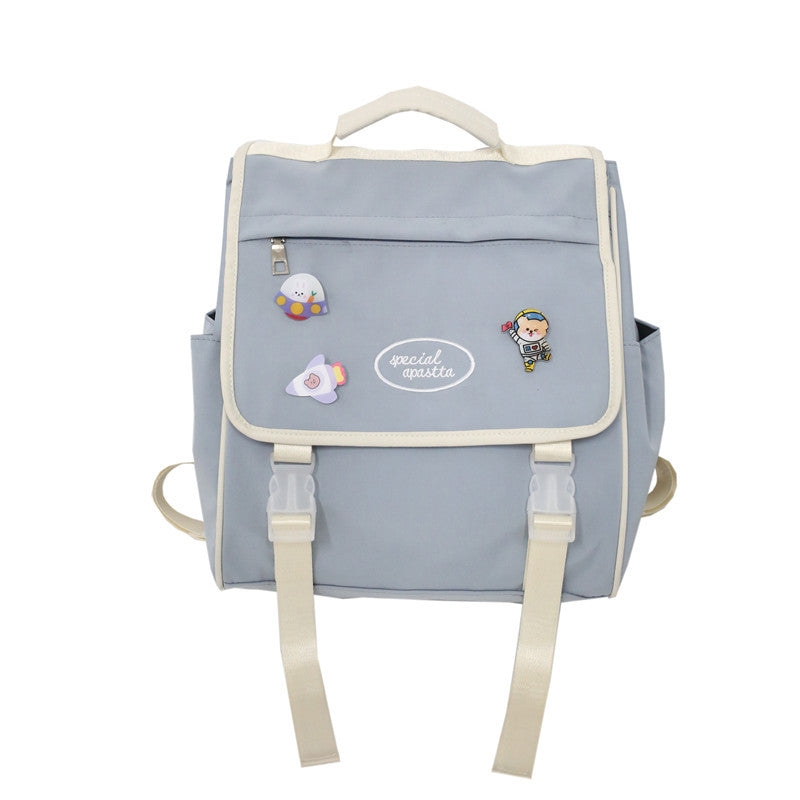 Gray backpack with cartoon character patches on a white background