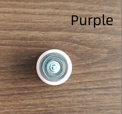 Round purple object with a pattern on a wooden surface