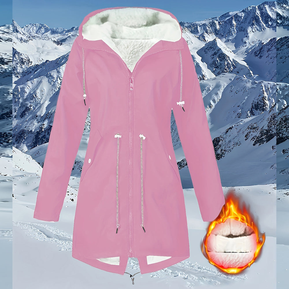 Pink winter coat with white fur lining on a snowy mountain background