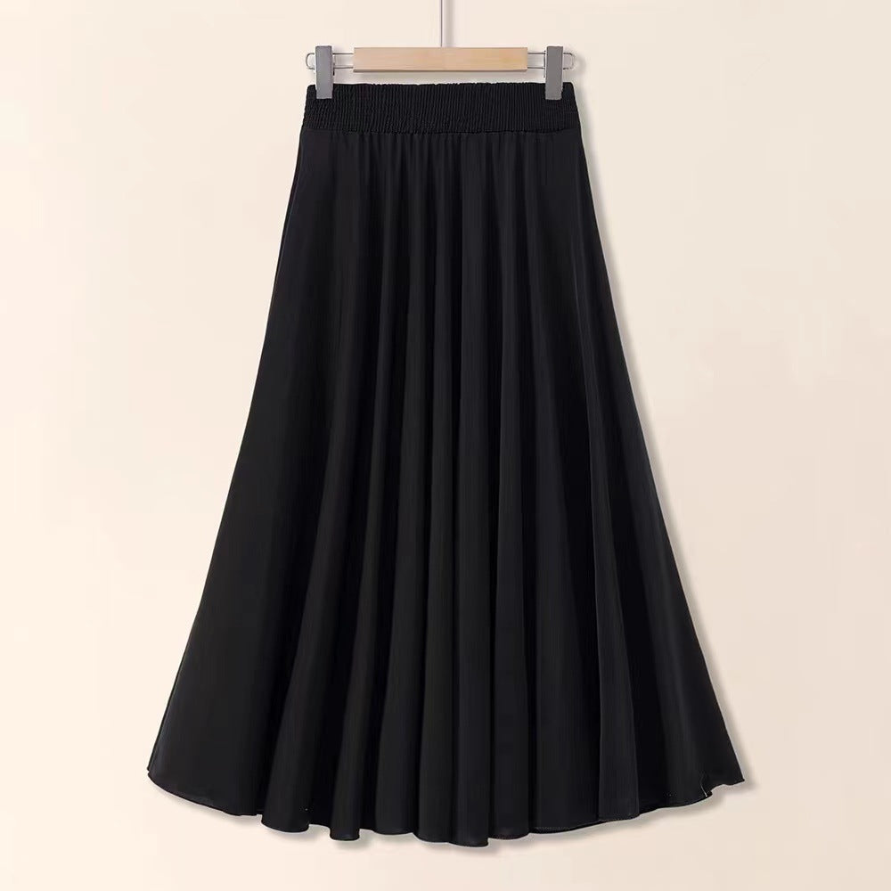 Black skirt on a hanger against a beige background