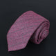 Pink and gray patterned tie on a black background