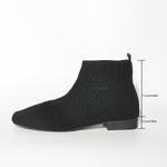 Black sock boot on a white background with measurements indicated