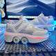White sneakers with pink accents on a computer keyboard