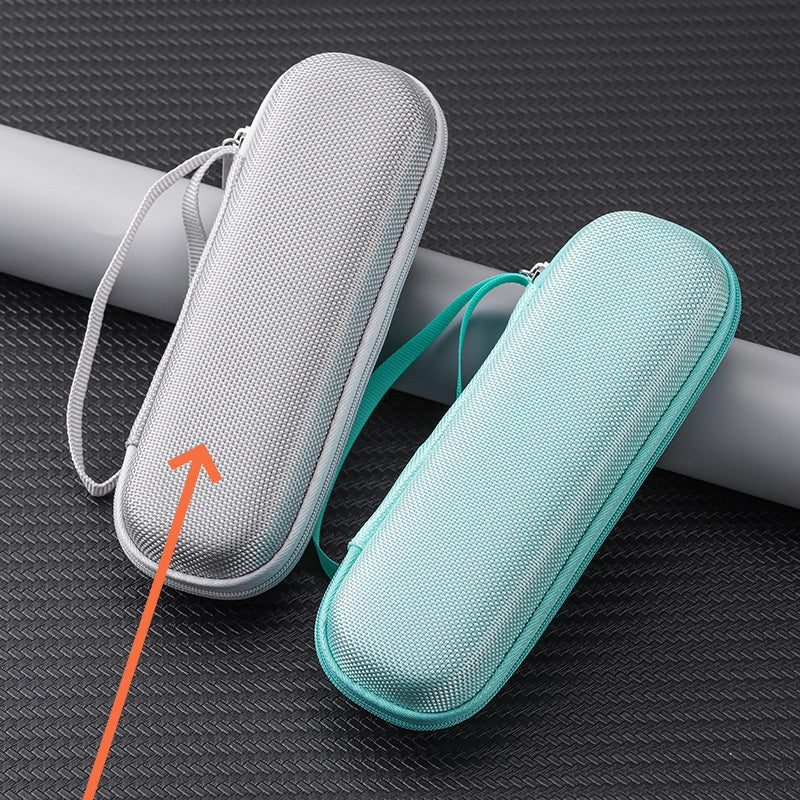 Two mesh cases, one gray and one teal, on a textured black surface with an orange arrow pointing to the gray case.