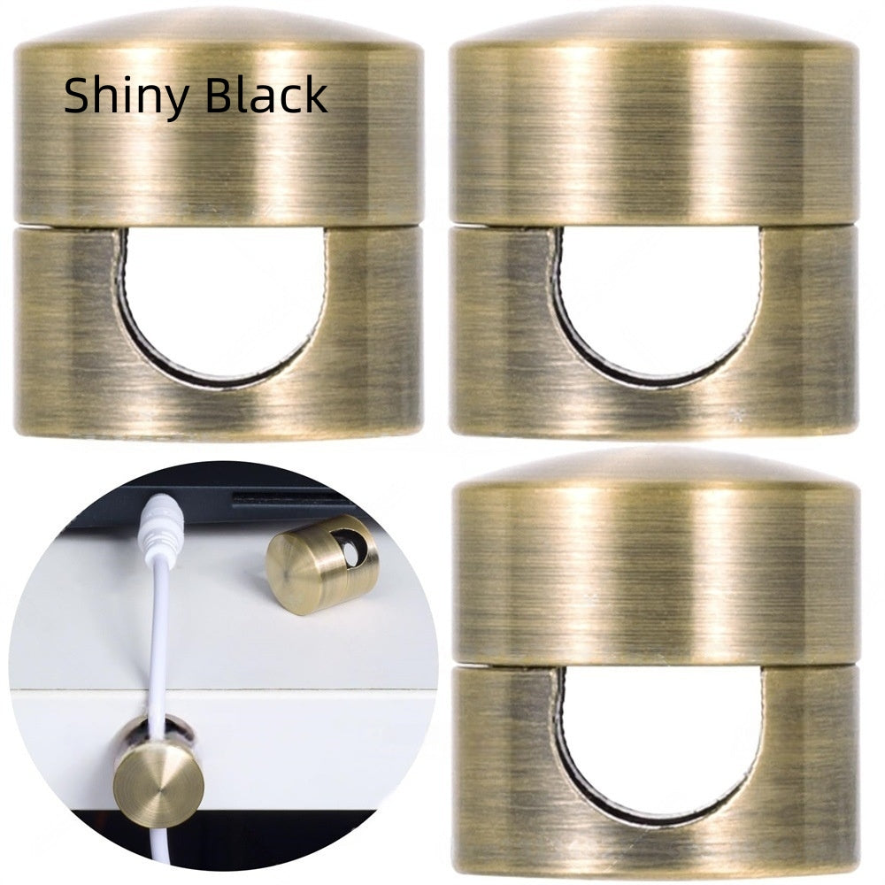 Brass-colored door stoppers with 'Shiny Black' label and close-up of a white cable and brass stopper.