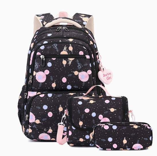 A matching backpack and school accessory set on a white background. The set includes a black backpack with a pastel cosmic print, a small shoulder bag, a pencil case, and a heart-shaped tag that reads 'Bustle Girl'.