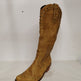 Brown knee-high boot with studded details on a white background