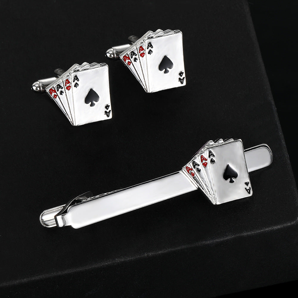 Cufflinks and tie clip set with playing card design on a black background