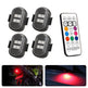 Four LED lights with a remote control on a white background