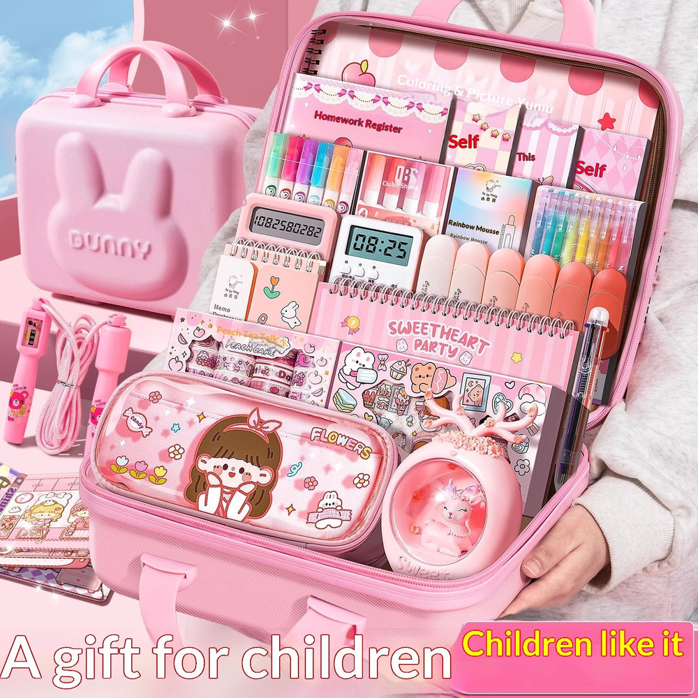 Pink stationery set with various items including a digital clock, notebooks, and stationery items, displayed in an open pink case.