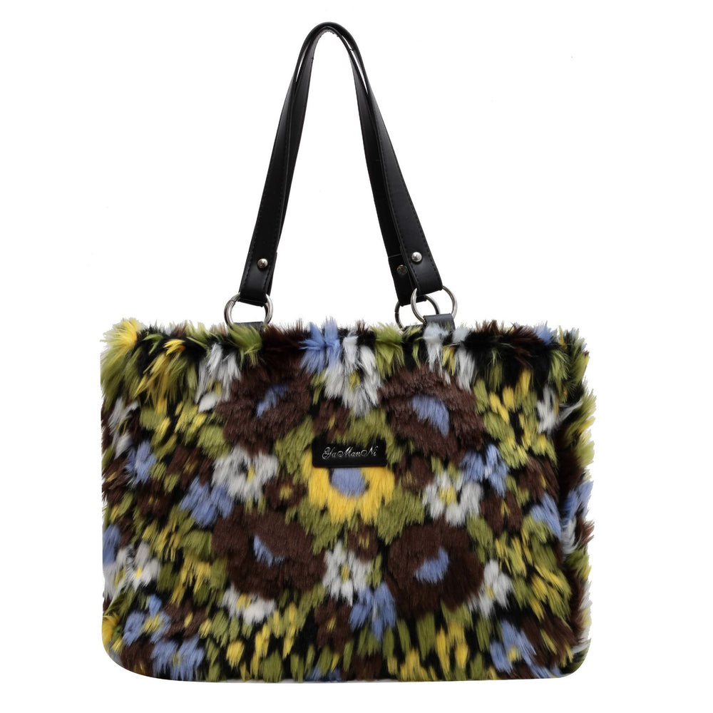Multicolored fur handbag with a black handle on a white background