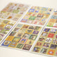 Sheet of colorful vintage-style postcards with various designs.