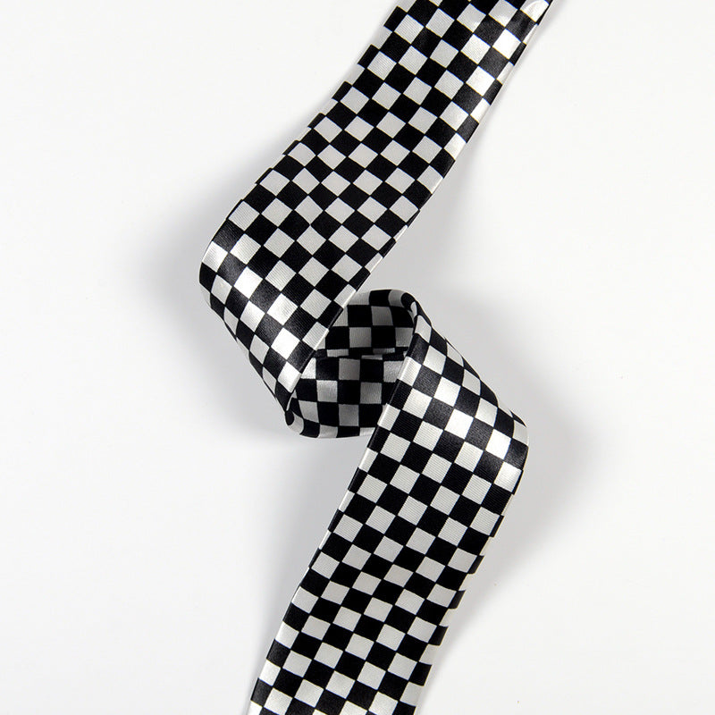 Black and white checkered ribbon on a light gray background