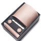 Tie set with tie, tie clip, and cufflinks in a black box on a white background