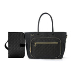 Black quilted handbag with gold zipper on a white background
