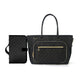 Black quilted handbag with gold zipper on a white background