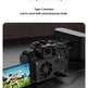 A black digital camera with its screen turned on, shown charging from a black power bank on a dark surface. Text at the top reads 'Charge while using', 'Worry-free battery life', 'Type-C interface', and 'Can be used with external power bank'.