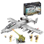 Toy airplane set with figures and cannon, featuring a model of an airplane in the packaging.