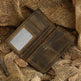 Brown leather wallet on a rustic fabric background