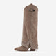 A single knee-high taupe suede boot with silver rhinestone embellishments around the pointed toe and a decorative silver buckle near the top shaft, shown against a plain white background.