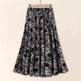 Skirt with black and gray pattern on a beige background
