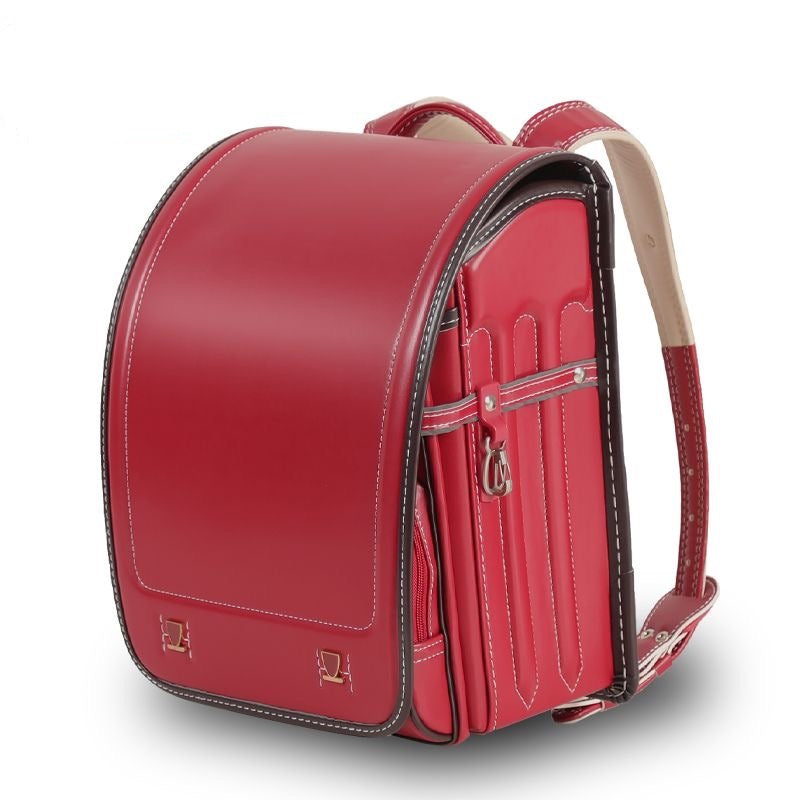 Red backpack on a white background